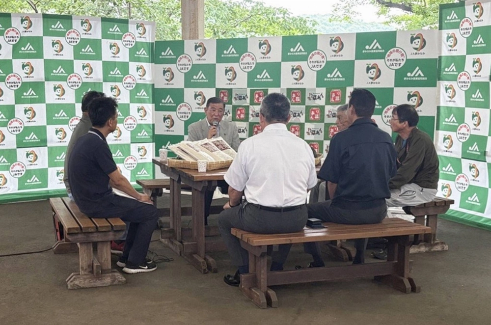 Prime Minister Shigeru Ishiba (background center) talks with local farmers in Shirakawa, Fukushima Prefecture, on Friday. The candidates of the Liberal Democratic Party and the main opposition Constitutional Democratic Party of Japan are set to go head-to-head for the seat there. Prime Minister Shigeru Ishiba (background center) talks with local farmers in Shirakawa, Fukushima Prefecture, on Friday. The candidates of the Liberal Democratic Party and the main opposition Constitutional Democratic Party of Japan are set to go head-to-head for the seat there.
