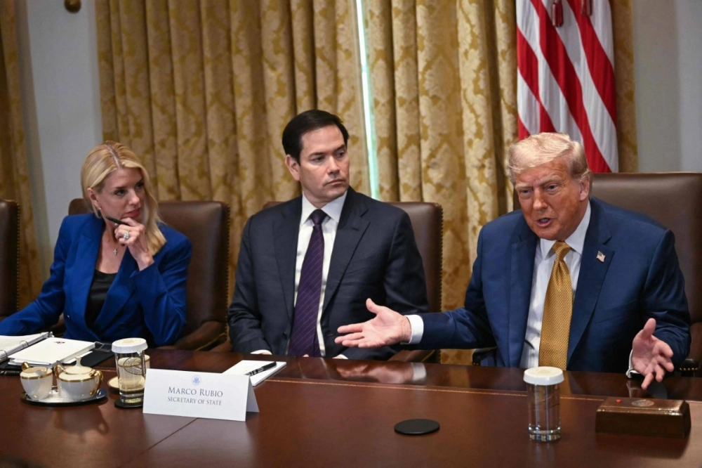 U.S. President Donald Trump speaks as Attorney General Pam Bondi (left) and Secretary of State Marco Rubio (center) look on during a Cabinet meeting at the White House in Washington on Tuesday. U.S. President Donald Trump speaks as Attorney General Pam Bondi (left) and Secretary of State Marco Rubio (center) look on during a Cabinet meeting at the White House in Washington on Tuesday.
