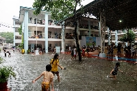 Children play amid flooding at a school temporarily converted into an evacuation center following heavy rains brought by Typhoon Gaemi, in Marikina City, Metro Manila, Philippines, in July 2024. | REUTERS