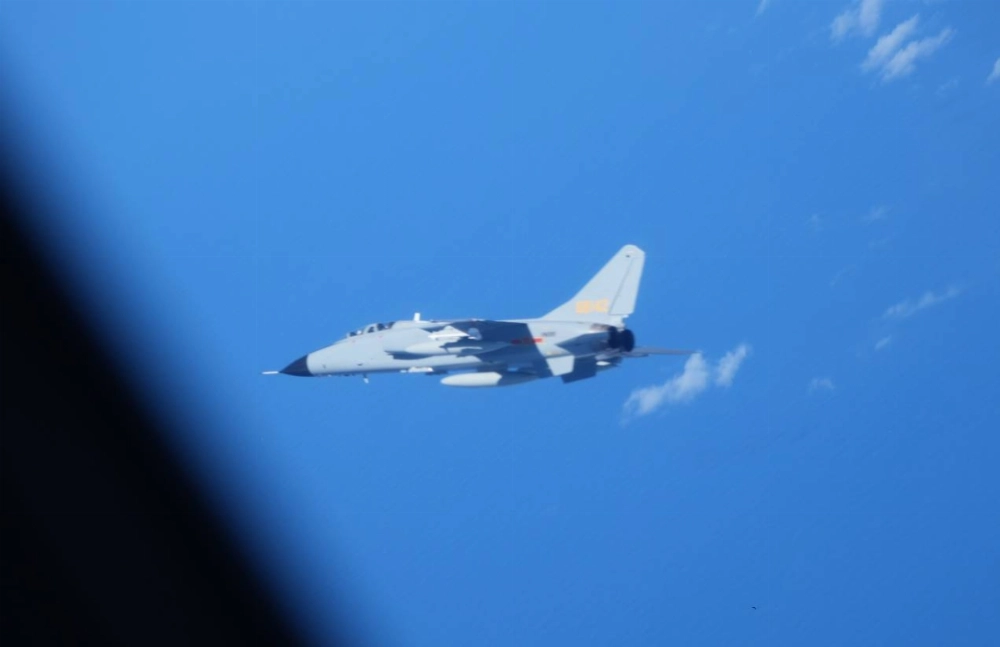 A Chinese JH-7 fighter jet makes an near an Air Self-Defense Force YS-11EB surveillance aircraft over the East China Sea this week in this image released Thursday.  A Chinese JH-7 fighter jet makes an near an Air Self-Defense Force YS-11EB surveillance aircraft over the East China Sea this week in this image released Thursday.
