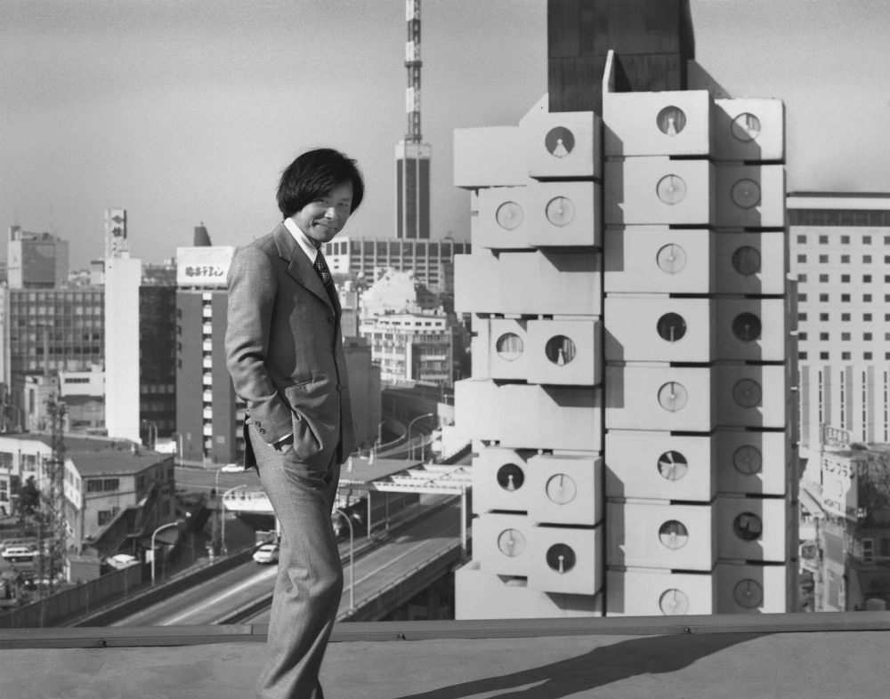 Nakagin Capsule Tower architect Kisho Kurokawa in front of the structure two years after its completion in 1972. Nakagin Capsule Tower architect Kisho Kurokawa in front of the structure two years after its completion in 1972.