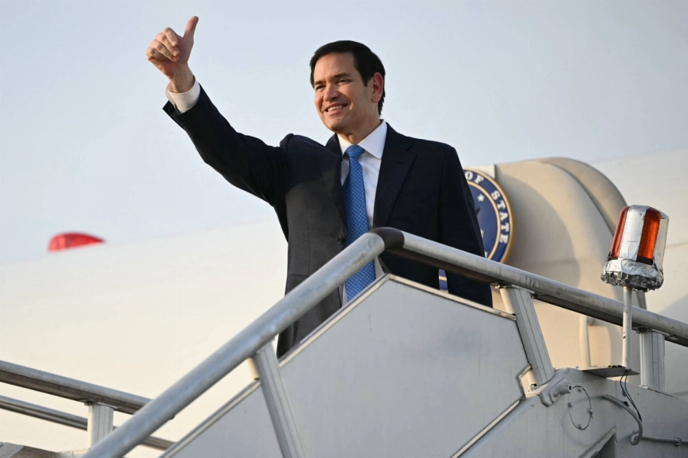 U.S. Secretary of State Marco Rubio gestures as he boards his flight before departing from Subang Air Base, on the outskirts of Kuala Lumpur, on Friday.  U.S. Secretary of State Marco Rubio gestures as he boards his flight before departing from Subang Air Base, on the outskirts of Kuala Lumpur, on Friday.