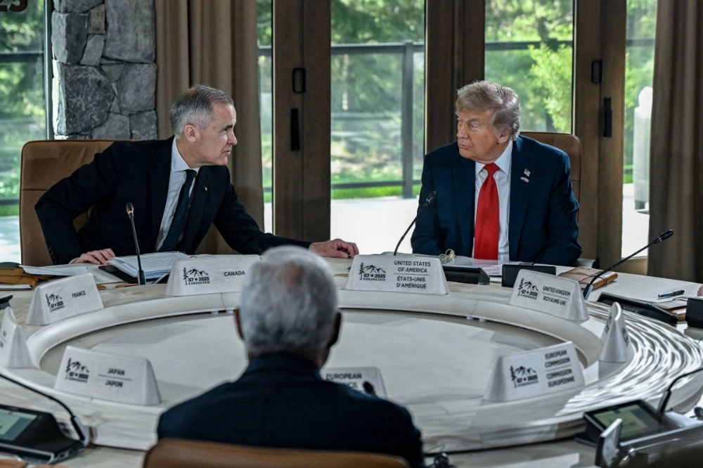 U.S. President Donald Trump and Canadian Prime Minister Mark Carney speak at the Group of Seven summit in Kananaskis, Alberta, on June 16. U.S. President Donald Trump and Canadian Prime Minister Mark Carney speak at the Group of Seven summit in Kananaskis, Alberta, on June 16.