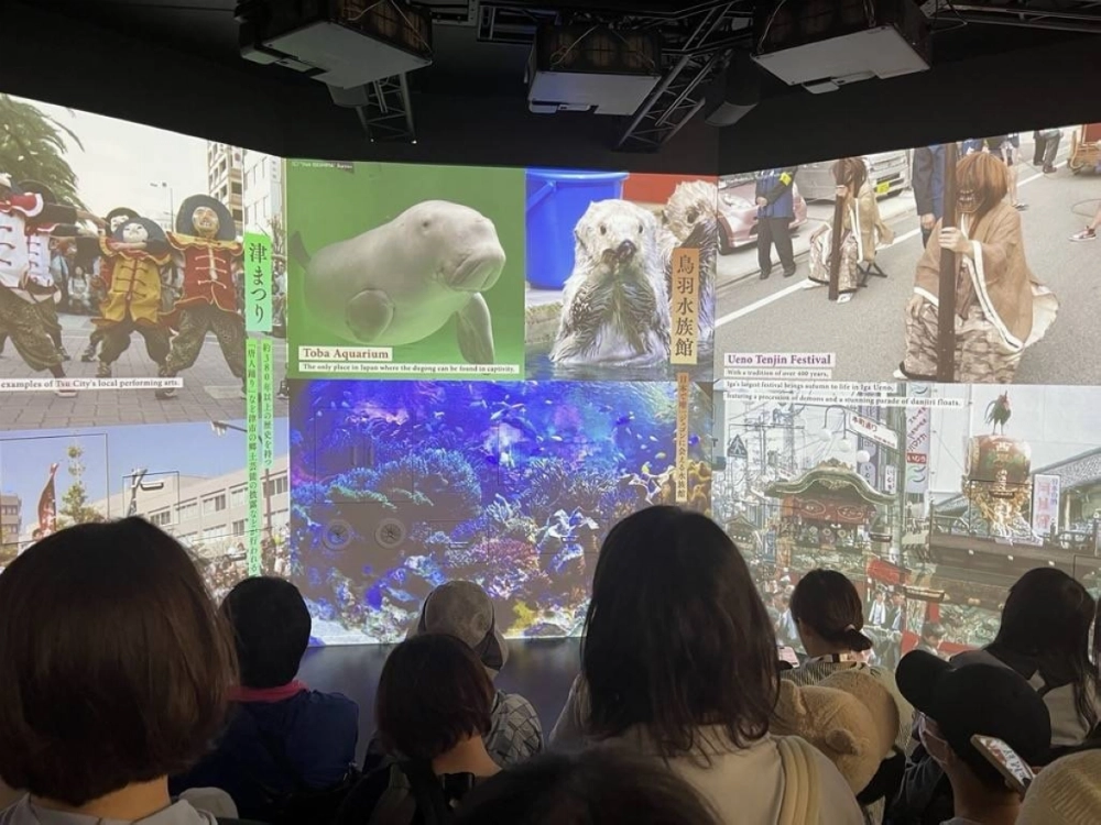 People check out Mie Prefecture's exhibit inside the Kansai Pavilion at the Osaka Expo in May.    People check out Mie Prefecture's exhibit inside the Kansai Pavilion at the Osaka Expo in May.