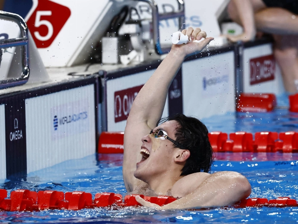 China's Wang Haoyu celebrates winning the men's 4x100m freestyle relay final at the World Aquatics Championships in Doha in February 2024. China's Wang Haoyu celebrates winning the men's 4x100m freestyle relay final at the World Aquatics Championships in Doha in February 2024.
