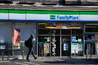 FamilyMart's operating profit grew 17.9% from a year before to ¥27.8 billion, as advertisements featuring Los Angeles Dodgers star Shohei Ohtani helped attract more customers and boost sales of onigiri rice balls. | Bloomberg