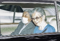Emperor Emeritus Akihito is accompanied by Empress Emerita Michiko as he travels to the University of Tokyo Hospital on Monday. | Jiji