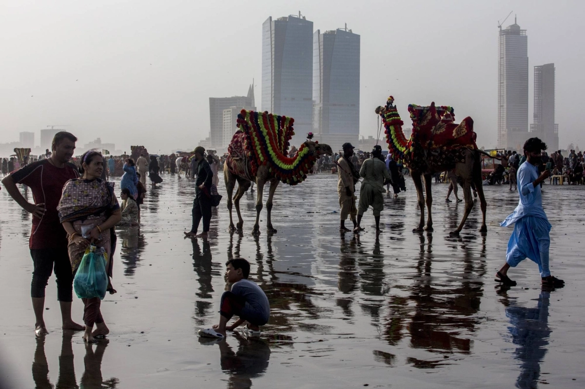 Crowds flock to Clifton Beach to try to escape the heat, in Karachi, Pakistan, on June 15. Crowds flock to Clifton Beach to try to escape the heat, in Karachi, Pakistan, on June 15.