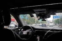 A driverless car by Apollo Go, Baidu's robotaxi service, drives on a road in Wuhan, Hubei province, China, on July 19, 2024.  | REUTERS