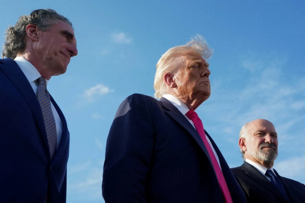 U.S. President Donald Trump, U.S. Secretary of the Interior Doug Burgum (left) and U.S. Secretary of Commerce Howard Lutnick at Joint Base Andrews, Maryland, on Tuesday U.S. President Donald Trump, U.S. Secretary of the Interior Doug Burgum (left) and U.S. Secretary of Commerce Howard Lutnick at Joint Base Andrews, Maryland, on Tuesday