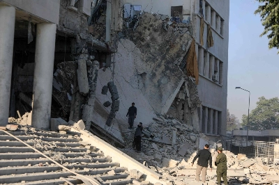 Members of the Syrian security forces assess the destruction inside the heavily damaged Syrian army and Defense Ministry headquarters complex in Damascus, following Israeli strikes Wednesday. Members of the Syrian security forces assess the destruction inside the heavily damaged Syrian army and Defense Ministry headquarters complex in Damascus, following Israeli strikes Wednesday.