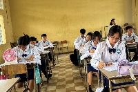 Students use fans to cool down during a class at a school in Phnom Penh in May last year.  | REUTERS