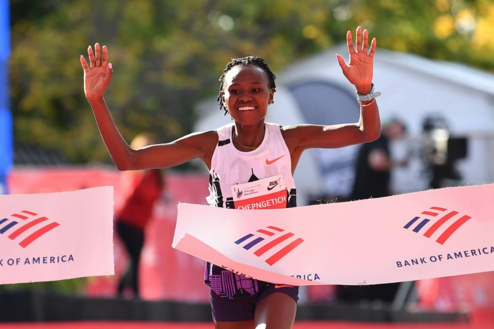 Ruth Chepngetich of Kenya finishes first in the women’s race to set a new world record during the Chicago Marathon on Oct. 13, 2024. Ruth Chepngetich of Kenya finishes first in the women’s race to set a new world record during the Chicago Marathon on Oct. 13, 2024.