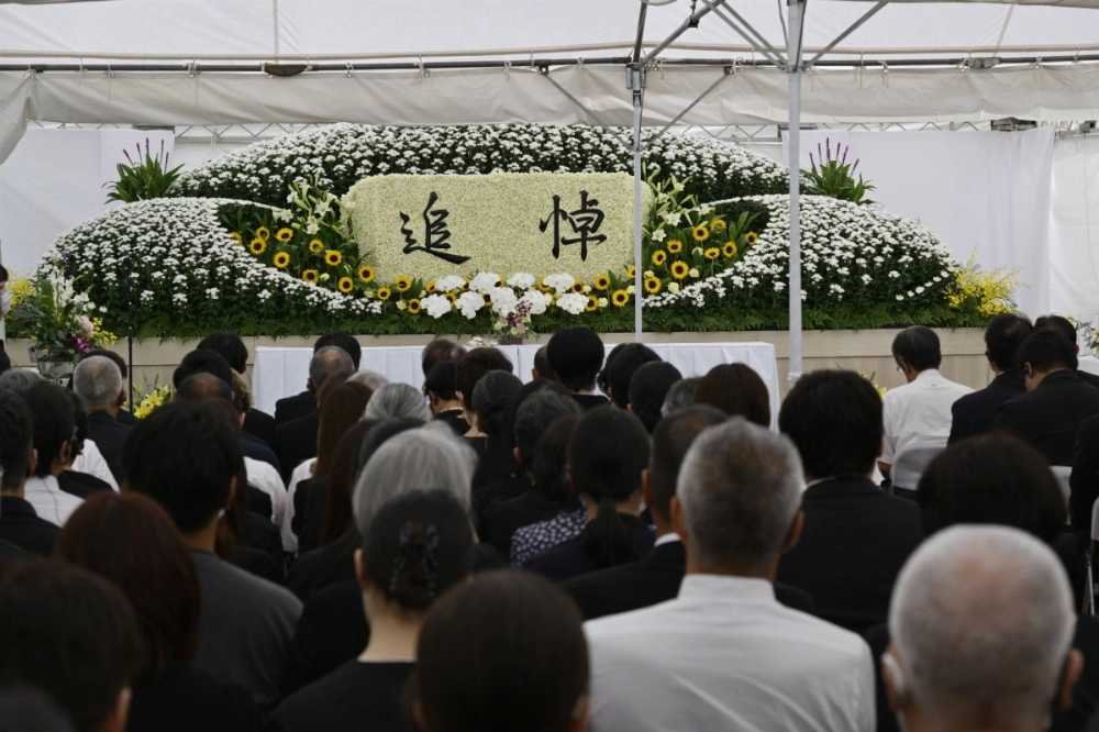 A memorial is held at the site of Kyoto Animation Co.'s No. 1 studio, in the city of Kyoto on Friday. A memorial is held at the site of Kyoto Animation Co.'s No. 1 studio, in the city of Kyoto on Friday.