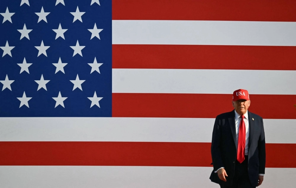 U.S. President Donald Trump steps on stage to deliver remarks at the Salute to America Celebration at the Iowa State Fairgrounds in Des Moines on July 3. U.S. President Donald Trump steps on stage to deliver remarks at the Salute to America Celebration at the Iowa State Fairgrounds in Des Moines on July 3.