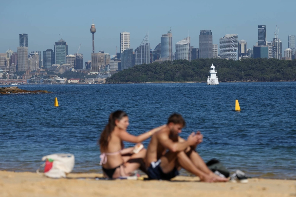 Sunbathers apply sunscreen at a beach in Sydney in April. Amid a debate over sunscreen regulations, some say that bans on ingredients that are hard to find alternatives for may restrict access to effective tools against skin disease.  Sunbathers apply sunscreen at a beach in Sydney in April. Amid a debate over sunscreen regulations, some say that bans on ingredients that are hard to find alternatives for may restrict access to effective tools against skin disease.