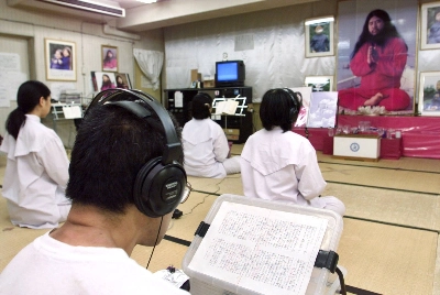Followers of doomsday cult Aum Shinrikyo chant in religious training before a portrait of guru Shoko Asahara in 1999 at Aum's Adachi Ward office in Tokyo, where extensive facilities are located. Followers of doomsday cult Aum Shinrikyo chant in religious training before a portrait of guru Shoko Asahara in 1999 at Aum's Adachi Ward office in Tokyo, where extensive facilities are located.