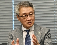 Mizuho Investor Relations President Eiichi Yamazaki speaks during an interview on July 14 in Tokyo's Chiyoda Ward. | Jiji