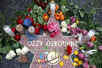Flowers are left at a makeshift memorial at Ozzy Osbourne's Star on the Hollywood Walk of Fame on Tuesday in Los Angeles. | AFP-JIJI