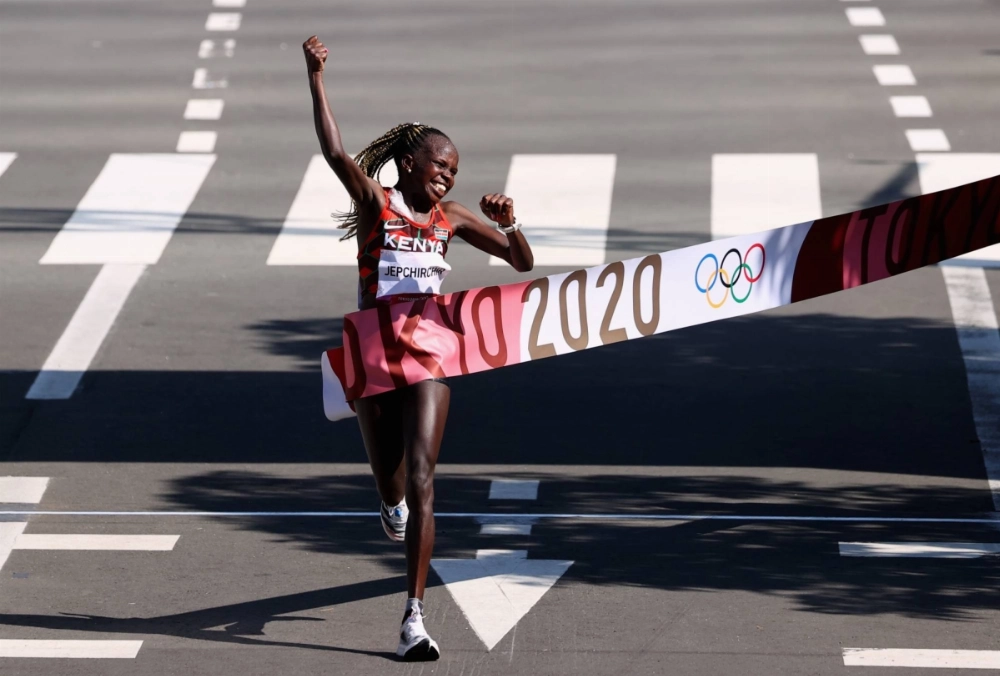 Peres Jepchirchir of Kenya celebrates after winning women's marathon gold at the Tokyo 2020 Olympic games at Sapporo Odori Park in Hokkaido, Japan on Aug. 7, 2021. Peres Jepchirchir of Kenya celebrates after winning women's marathon gold at the Tokyo 2020 Olympic games at Sapporo Odori Park in Hokkaido, Japan on Aug. 7, 2021.