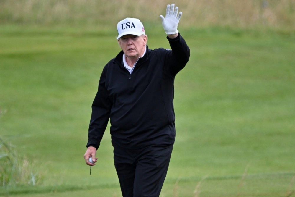 U.S. President Donald Trump waves as he plays golf at the Trump Turnberry Golf Courses, in Turnberry, on the southwestern coast of Scotland, on Saturday. U.S. President Donald Trump waves as he plays golf at the Trump Turnberry Golf Courses, in Turnberry, on the southwestern coast of Scotland, on Saturday.