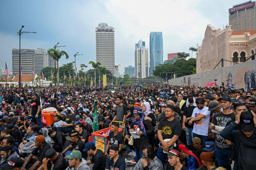 Protesters gather near Merdeka Square during a protest against Malaysia's Prime Minister Anwar Ibrahim in Kuala Lumpur on Saturday. Protesters gather near Merdeka Square during a protest against Malaysia's Prime Minister Anwar Ibrahim in Kuala Lumpur on Saturday.