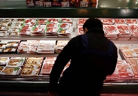 Prolonged high prices for food and other goods have pushed down consumer sentiment and real wages, according to the Annual Report on the Japanese Economy and Public Finance for fiscal 2025. | Reuters
