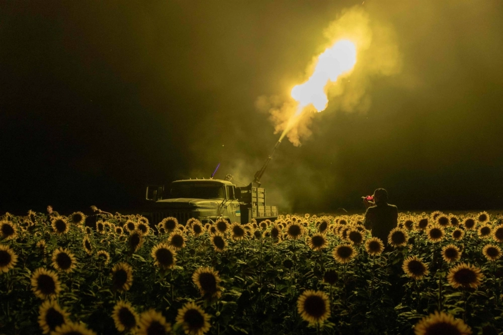 Ukrainian service members fire an anti-aircraft cannon toward a Russian drone from a sunflower field during an air attack near Pavlograd, Dnipropetrovsk region, in Ukraine on July 19. Ukrainian service members fire an anti-aircraft cannon toward a Russian drone from a sunflower field during an air attack near Pavlograd, Dnipropetrovsk region, in Ukraine on July 19.