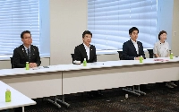 Kazuhiko Shigetoku (second from left), policy chief of the Constitutional Democratic Party, speaks at a meeting of opposition party policy leaders discussing a bill to scrap the provisional add-on gasoline tax rate, on Tuesday at parliament. | Jiji