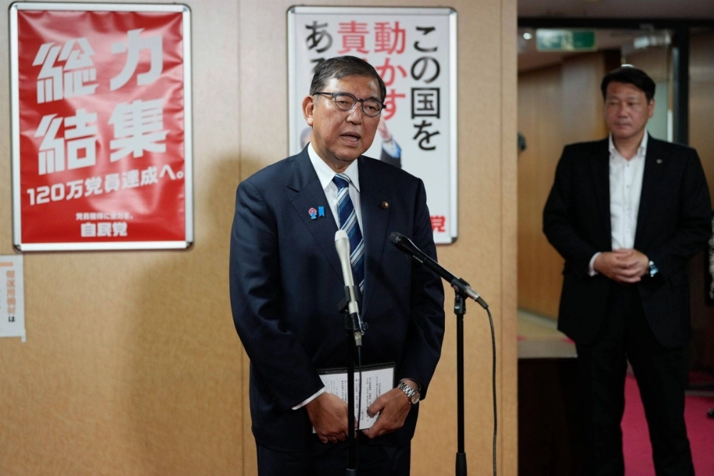 Prime Minister Shigeru Ishiba addresses a news conference in Tokyo on Monday. He repeated his pledge to stay on to prevent a political vacuum from forming after his party's poor performance in the Upper House election. Prime Minister Shigeru Ishiba addresses a news conference in Tokyo on Monday. He repeated his pledge to stay on to prevent a political vacuum from forming after his party's poor performance in the Upper House election.