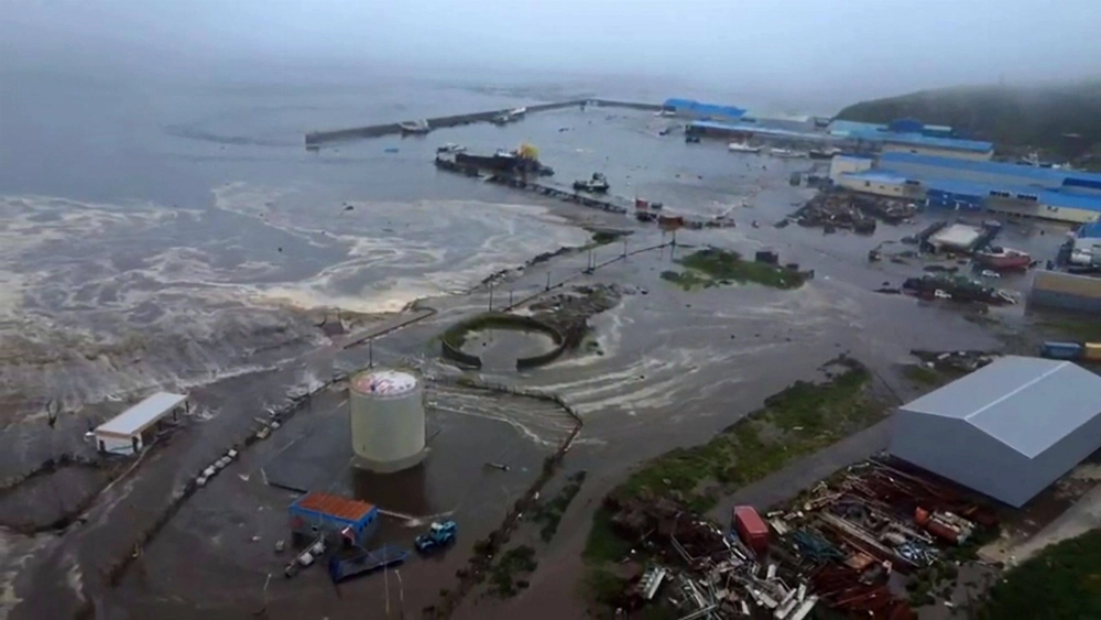 The town of Severo-Kurilsk on Russia's northern Kuril Islands is hit by a tsunami on Wednesday in this image taken by a drone. The town of Severo-Kurilsk on Russia's northern Kuril Islands is hit by a tsunami on Wednesday in this image taken by a drone.