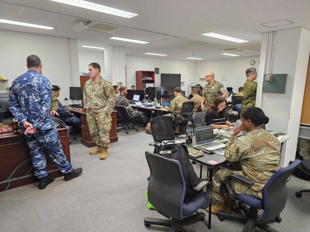 U.S., Japanese and Australian staff work in the JJOC Cooperation Team office at the U.S. Army’s Hardy Barracks in central Tokyo in this image posted to the Australian Embassy's X account on July 25. U.S., Japanese and Australian staff work in the JJOC Cooperation Team office at the U.S. Army’s Hardy Barracks in central Tokyo in this image posted to the Australian Embassy's X account on July 25.