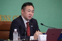 Justice Minister Keisuke Suzuki attends a news conference at the Japan National Press Club in Tokyo on Wednesday. | JIJI