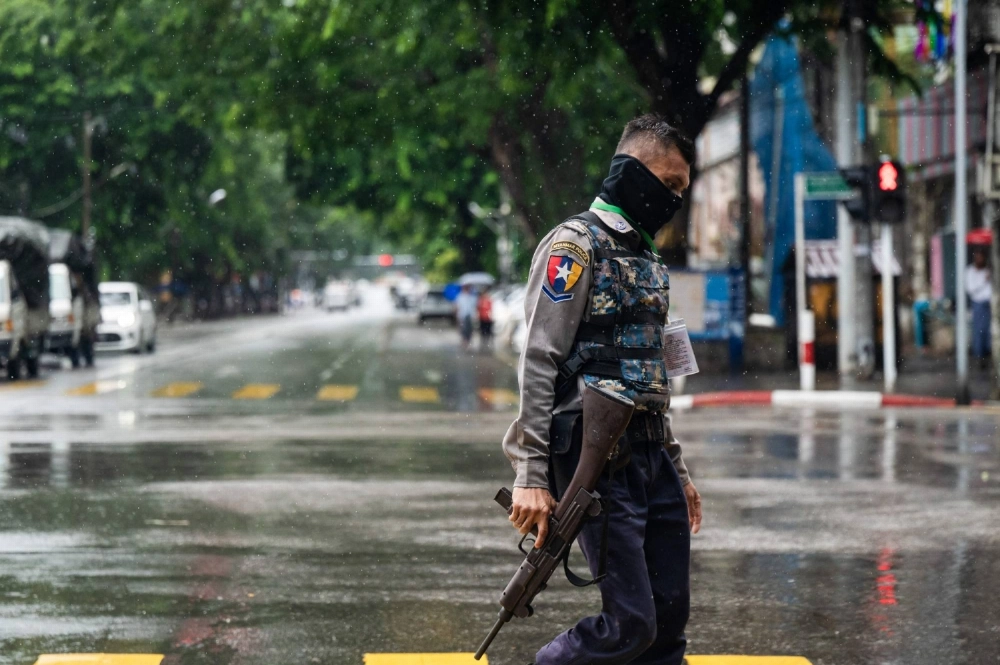 A policeman walks on a street in Yangon on July 19, 2025, on the 78th Martyrs' Day marking the anniversary of the assassination of independence leaders, including Gen. Aung San, the father of the currently deposed and imprisoned leader Aung San Suu Kyi. A policeman walks on a street in Yangon on July 19, 2025, on the 78th Martyrs' Day marking the anniversary of the assassination of independence leaders, including Gen. Aung San, the father of the currently deposed and imprisoned leader Aung San Suu Kyi.