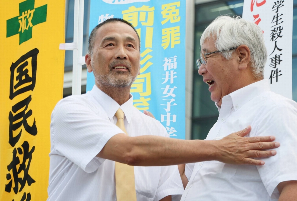 Shoshi Maekawa (left) celebrates in Kanazawa, Ishikawa Prefecture, on July 18 after a high court acquitted him of a 1986 murder of a junior high school girl. Shoshi Maekawa (left) celebrates in Kanazawa, Ishikawa Prefecture, on July 18 after a high court acquitted him of a 1986 murder of a junior high school girl.