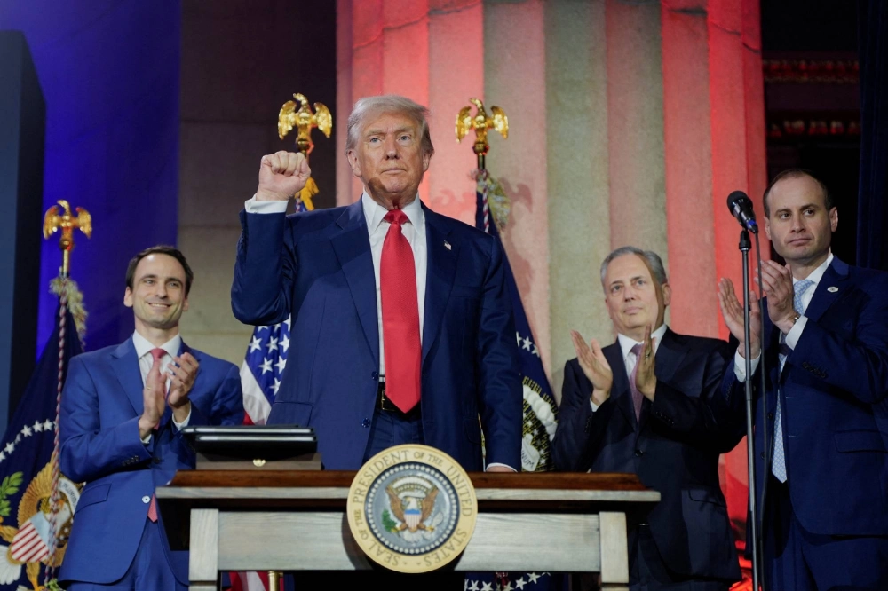 U.S. President Donald Trump celebrates after signing executive orders on artificial intelligence at the “Winning the AI Race” Summit in Washington on July 23. U.S. President Donald Trump celebrates after signing executive orders on artificial intelligence at the “Winning the AI Race” Summit in Washington on July 23.