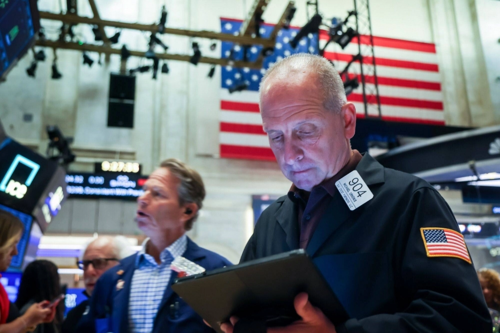 Traders work on the floor of the New York Stock Exchange in New York on Friday. Traders work on the floor of the New York Stock Exchange in New York on Friday.