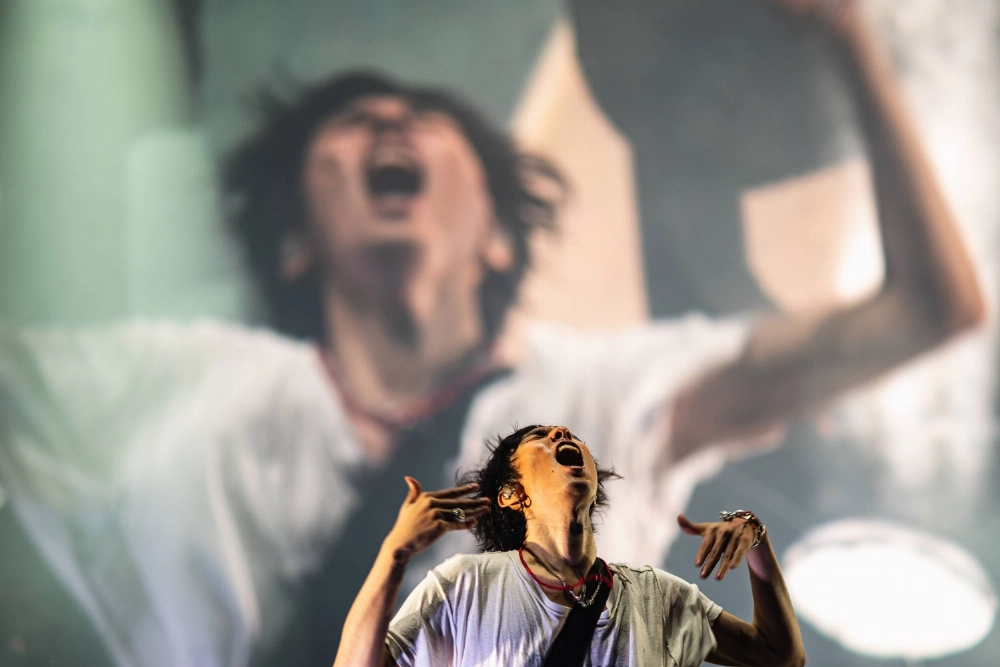 Radwimps lead singer Yojiro Noda threw himself into the rock band’s Green Stage performance ahead of headliner Vampire Weekend. Radwimps lead singer Yojiro Noda threw himself into the rock band’s Green Stage performance ahead of headliner Vampire Weekend.