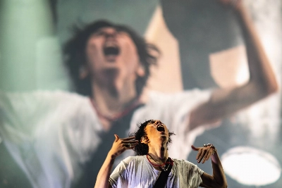 Radwimps lead singer Yojiro Noda threw himself into the rock band’s Green Stage performance ahead of headliner Vampire Weekend. Radwimps lead singer Yojiro Noda threw himself into the rock band’s Green Stage performance ahead of headliner Vampire Weekend.