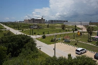 A children's playground next to the Freeport LNG export terminal in Texas. Existing socioeconomic disparities are being exacerbated as American LNG facilities “tend to be sited in areas that are disproportionately home to communities of color and low-income communities,” according to a U.S. Department of Energy study.  | Mara Budgen
