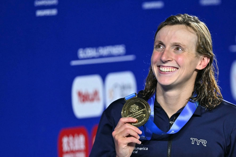 Katie Ledecky celebrates after winning gold in the women's 800-meter freestyle event at the World Aquatics Championships in Singapore on Saturday.  Katie Ledecky celebrates after winning gold in the women's 800-meter freestyle event at the World Aquatics Championships in Singapore on Saturday.