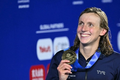 Katie Ledecky celebrates after winning gold in the women's 800-meter freestyle event at the World Aquatics Championships in Singapore on Saturday.  Katie Ledecky celebrates after winning gold in the women's 800-meter freestyle event at the World Aquatics Championships in Singapore on Saturday.