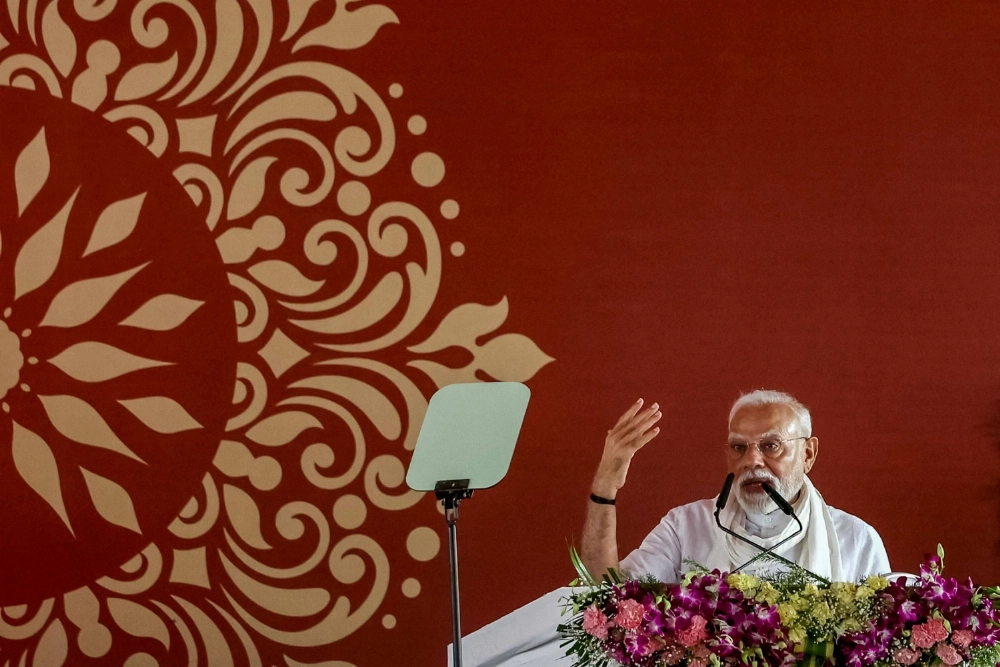 India's Prime Minister Narendra Modi gestures as he addresses a public gathering during the inauguration of various projects on the outskirts of the city of Varanasi, in the Indian state of Uttar Pradesh, on Saturday. India's Prime Minister Narendra Modi gestures as he addresses a public gathering during the inauguration of various projects on the outskirts of the city of Varanasi, in the Indian state of Uttar Pradesh, on Saturday.