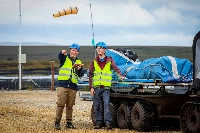 Doherty and intern Jacob Hamilton prepare to launch one the Kitepower Kites at their launch site at Bangor Erris, Ireland, on July 18. | AFP-JIJI
