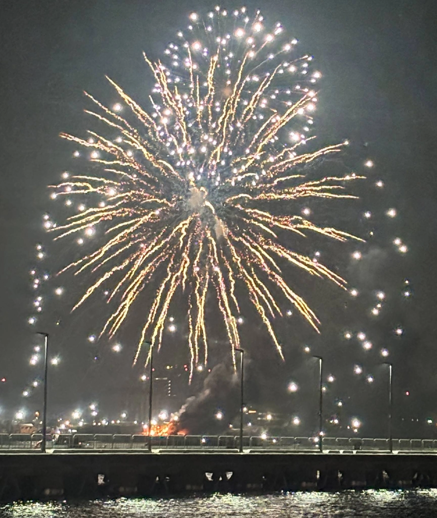 A fire breaks out from a launch barge (bottom) during a fireworks event in Yokohama on Monday evening. A fire breaks out from a launch barge (bottom) during a fireworks event in Yokohama on Monday evening.