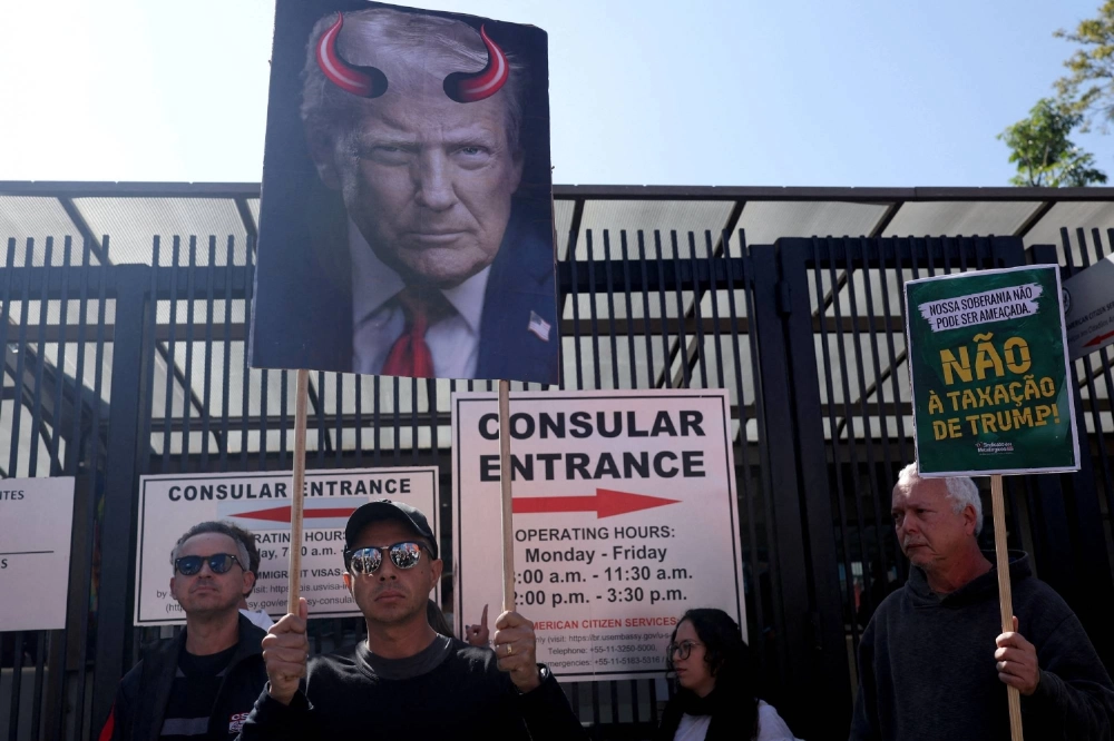 Demonstrators protest U.S. President Donald Trump's tariffs on Brazilian products at a rally outside the U.S. Consulate in Sao Paulo on Friday. Demonstrators protest U.S. President Donald Trump's tariffs on Brazilian products at a rally outside the U.S. Consulate in Sao Paulo on Friday.