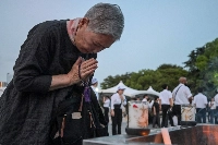 A woman prays at the Peace Memorial Park ahead of the memorial service to mark the 80th anniversary of the world's first atomic bomb attack, in the city of Hiroshima early on Wednesday. | AFP-Jiji