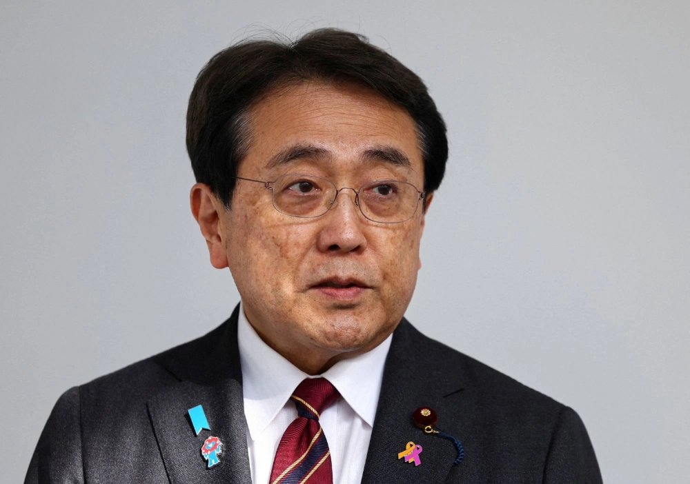 Ryosei Akazawa, Japan's chief tariff negotiator, said the U.S. made a clerical error in not including a “reciprocal” tariff rate ceiling for Japan in the trade deal. Ryosei Akazawa, Japan's chief tariff negotiator, said the U.S. made a clerical error in not including a “reciprocal” tariff rate ceiling for Japan in the trade deal.