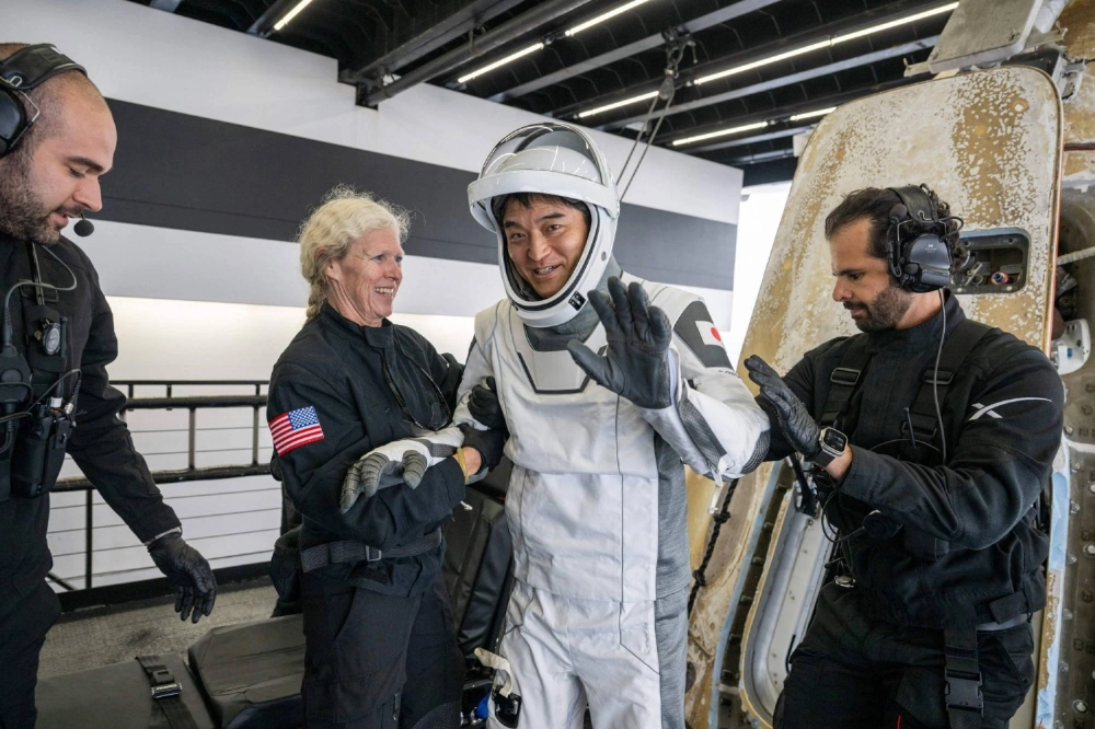 Japanese astronaut Takuya Onishi is helped out of the SpaceX Dragon Endurance spacecraft on board the SpaceX recovery ship Shannon after he and other crew members landed in the Pacific Ocean off the coast of San Diego, California, on Saturday. Japanese astronaut Takuya Onishi is helped out of the SpaceX Dragon Endurance spacecraft on board the SpaceX recovery ship Shannon after he and other crew members landed in the Pacific Ocean off the coast of San Diego, California, on Saturday.