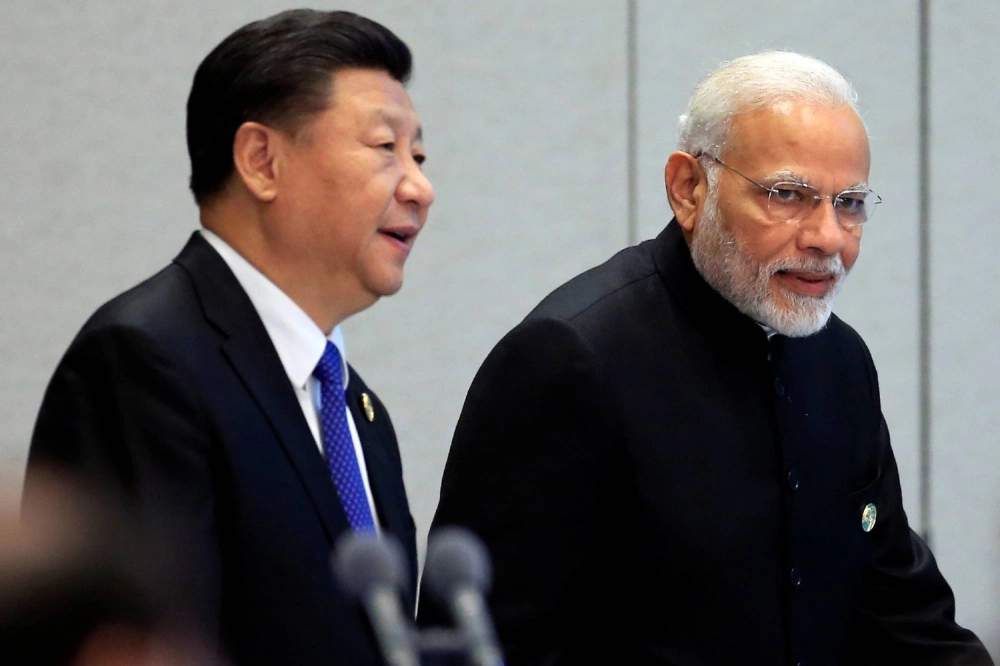 Chinese President Xi Jinping (left) and Indian Prime Minister Narendra Modi in Qingdao, Shandong Province, China, in 2018 Chinese President Xi Jinping (left) and Indian Prime Minister Narendra Modi in Qingdao, Shandong Province, China, in 2018